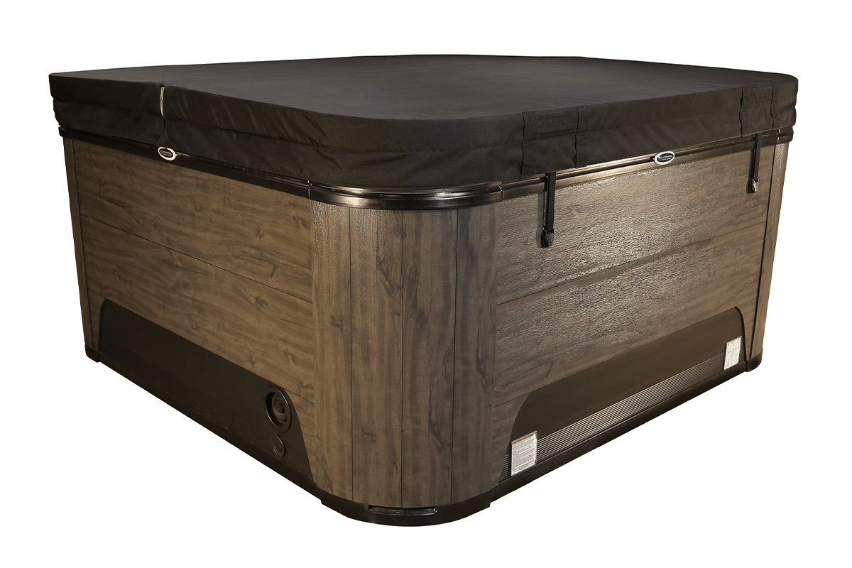 Spabadet med ett stängt svart lock mot en vit bakgrund