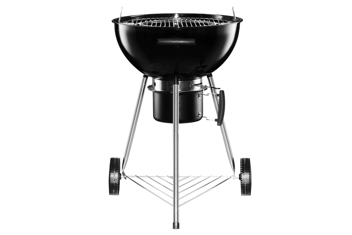 Grillen utan lock från sidan mot en vit bakgrund